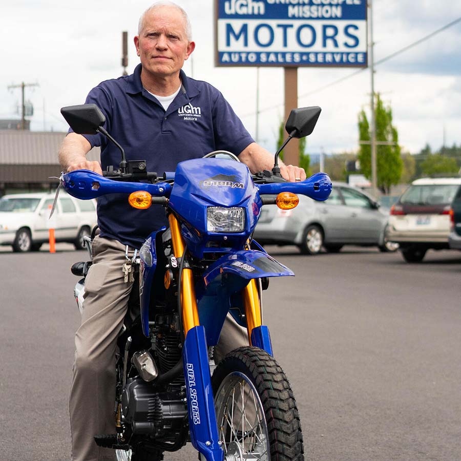 UGM Motors - Curt on a motorcycle