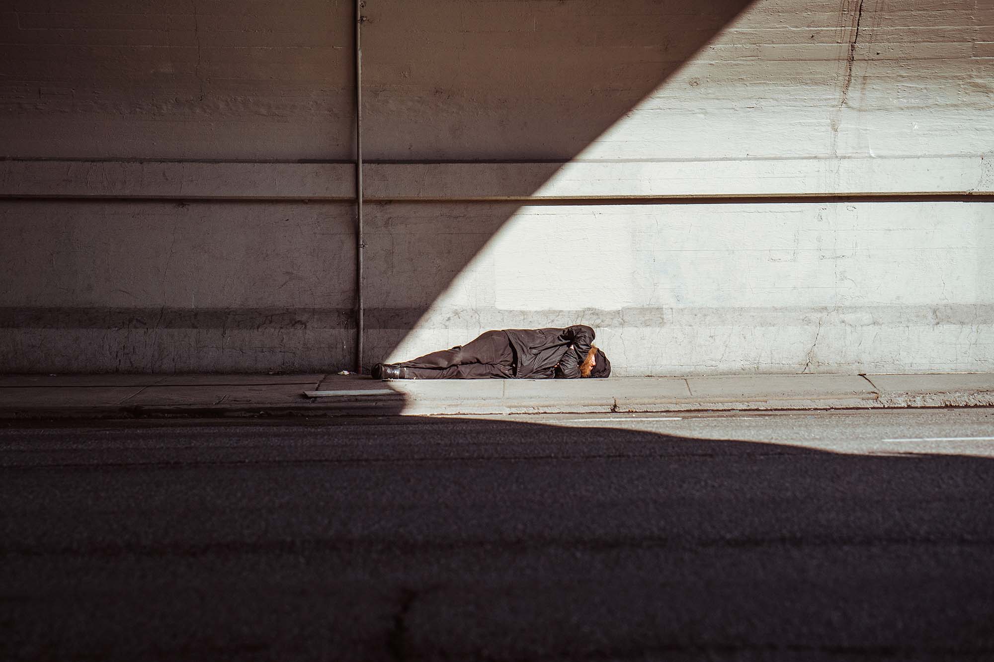 bg_homeless man sleeping underpass